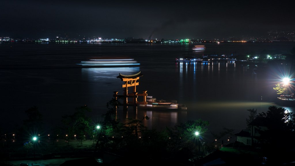 Long exposure of Miyajima Torii and party boat